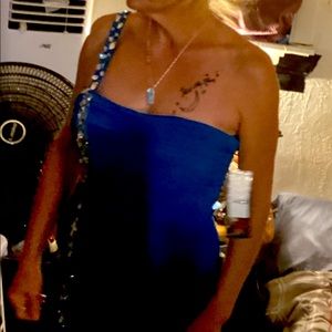 Lovely evening gown made by Reign On. size 7/8 teal color.still tagged